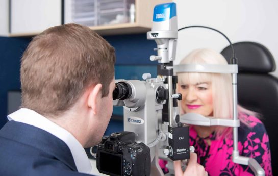 Dr Ryan checking a patients eyes