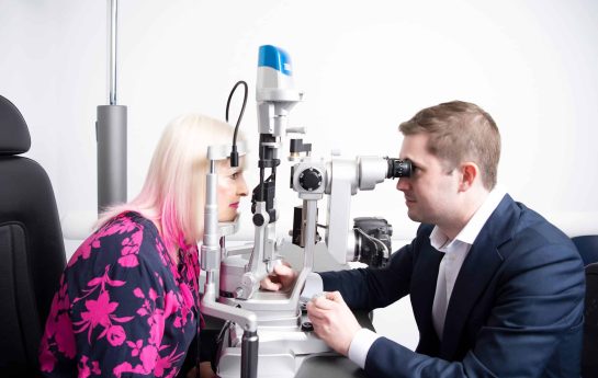 Dr Ryan checking a patients eyes